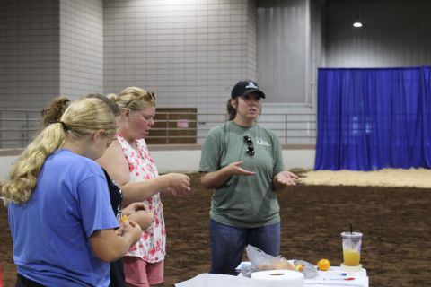 Four women talking at an event