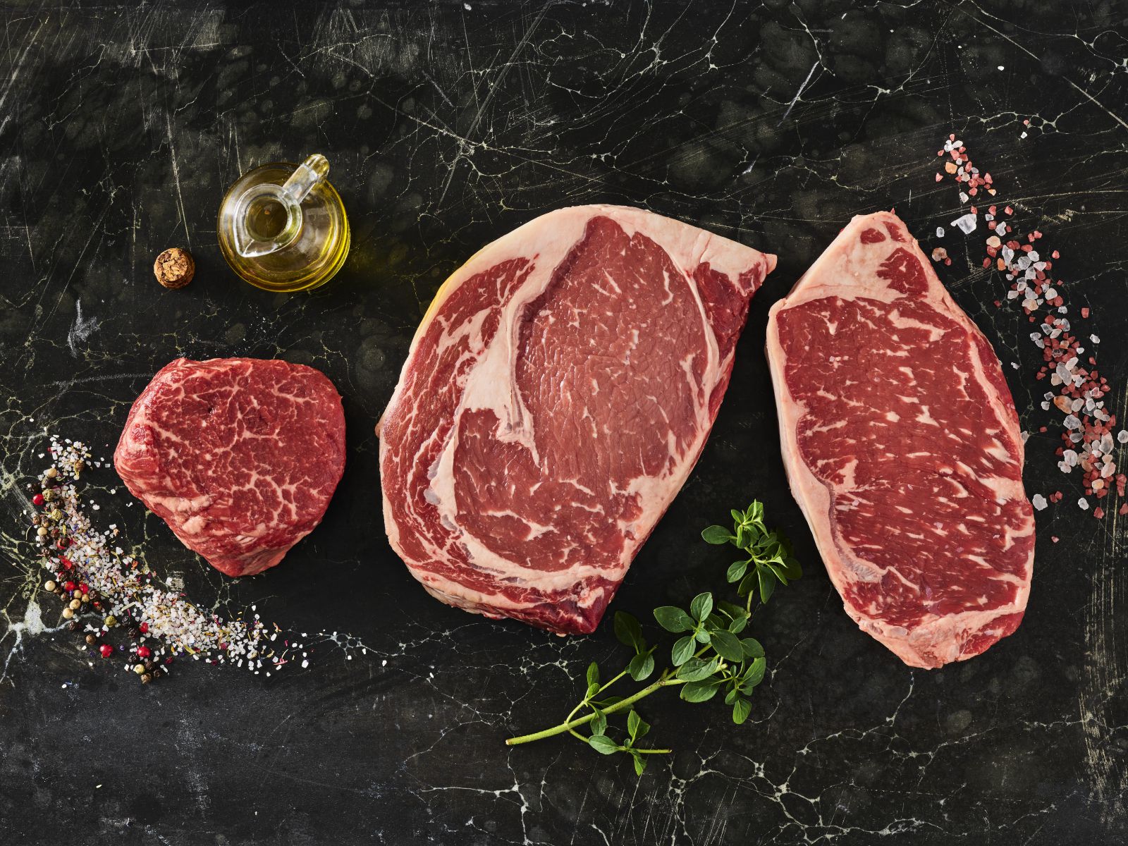 Three steaks on a table